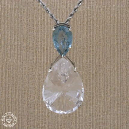 Pingente de cristal de rocha e topázio azul